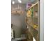 Well-organized laundry room with a large shelving unit for storage solutions at 219 Brown Branch Rd, Locust Grove, GA 30248