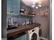 Efficient laundry room with a sink, countertop, and modern washer and dryer at 219 Brown Branch Rd, Locust Grove, GA 30248