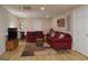Living room featuring laminate floors, two sofas, and an accent wall with an American flag at 219 Brown Branch Rd, Locust Grove, GA 30248