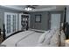 Comfortable main bedroom with plush bedding, stylish furnishings, and ample lighting at 219 Brown Branch Rd, Locust Grove, GA 30248