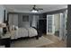 Spacious main bedroom boasts a tray ceiling, four poster bed, and ensuite access at 219 Brown Branch Rd, Locust Grove, GA 30248