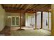 Covered tile patio with brick support pillars and view of the home's exterior at 219 Brown Branch Rd, Locust Grove, GA 30248