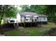 Charming backyard deck ideal for gatherings, with outdoor seating and a tranquil green space at 85 Pine Haven Dr, Carrollton, GA 30116