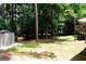 The backyard is full of green space, an outdoor storage shed, and wooded privacy at 85 Pine Haven Dr, Carrollton, GA 30116