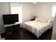 Bedroom with hardwood floors, natural lighting, and a comfortable bed at 85 Pine Haven Dr, Carrollton, GA 30116