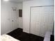 Bedroom with hardwood floors, closet doors and side entrance door at 85 Pine Haven Dr, Carrollton, GA 30116