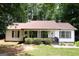 Charming single-story home featuring a covered front porch and well-maintained landscaping at 85 Pine Haven Dr, Carrollton, GA 30116