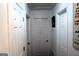 Hallway view highlighting multiple white doors and wall art at 85 Pine Haven Dr, Carrollton, GA 30116