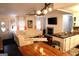 Spacious living room featuring a fireplace, modern lighting, and a comfortable white leather sofa at 85 Pine Haven Dr, Carrollton, GA 30116