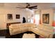 Bright living room featuring a white sectional couch, fireplace, and ceiling fan at 85 Pine Haven Dr, Carrollton, GA 30116