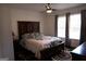 Comfortable bedroom featuring a ceiling fan, with ample natural light from dual windows at 85 Pine Haven Dr, Carrollton, GA 30116