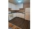 A kitchen with white cabinets, a gas range, and a refrigerator at 6485 Boca Grande Blvd, Forest Park, GA 30297