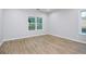 Bright bedroom with hardwood floors and a large window bringing in natural light at 809 Dill Sw Ave, Atlanta, GA 30310