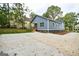 Charming home with a large driveway, manicured lawn, and a welcoming front porch at 809 Dill Sw Ave, Atlanta, GA 30310