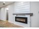 Modern electric fireplace with sleek design, offering a cozy ambiance in the home at 809 Dill Sw Ave, Atlanta, GA 30310