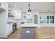 Bright kitchen with an island, stainless appliances, and white cabinets, creating a clean aesthetic at 809 Dill Sw Ave, Atlanta, GA 30310