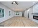 Spacious living room featuring refinished wood floors, recessed lighting, and a modern ceiling fan at 809 Dill Sw Ave, Atlanta, GA 30310