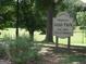 Welcome to Historic Adair Park sign in a grassy area with mature trees at 809 Dill Sw Ave, Atlanta, GA 30310
