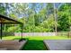 Wide backyard with two wooden platforms, privacy fence and gazebo, ideal for outdoor enjoyment at 411 Hopi Ln, Villa Rica, GA 30180