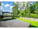 Large backyard with privacy fence, wooden platforms, and a gazebo, perfect for outdoor gatherings at 411 Hopi Ln, Villa Rica, GA 30180