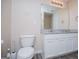 Secondary bathroom featuring granite countertops, wood floor, and a toilet at 411 Hopi Ln, Villa Rica, GA 30180
