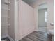 Bathroom featuring wood look floor, shower curtain, and toilet at 411 Hopi Ln, Villa Rica, GA 30180