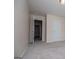 Bright bedroom features neutral walls, carpet, and easy access to closet and doorway at 411 Hopi Ln, Villa Rica, GA 30180