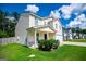 Side view of a two-story home featuring a covered porch and well-manicured lawn at 411 Hopi Ln, Villa Rica, GA 30180