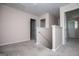 Upstairs hallway with carpet and view of the banister of the staircase at 411 Hopi Ln, Villa Rica, GA 30180