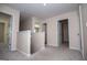 Spacious upstairs hallway with carpet with three doors to different rooms at 411 Hopi Ln, Villa Rica, GA 30180