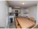 Eat-in kitchen with wood table, granite counters and white cabinets at 411 Hopi Ln, Villa Rica, GA 30180