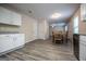Open concept kitchen/dining with granite counters and luxury vinyl plank flooring at 411 Hopi Ln, Villa Rica, GA 30180