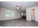 Open-concept living space with luxury vinyl plank flooring leading to dining area at 411 Hopi Ln, Villa Rica, GA 30180