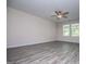 A light and airy living room with luxury vinyl plank flooring and ceiling fan at 411 Hopi Ln, Villa Rica, GA 30180