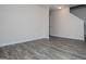A spacious living room with luxury vinyl plank flooring and fresh paint at 411 Hopi Ln, Villa Rica, GA 30180