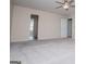 Spacious main bedroom featuring neutral carpet, a ceiling fan, and an ensuite bathroom at 411 Hopi Ln, Villa Rica, GA 30180