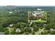 Aerial shot showcasing the property nestled among lush greenery near Lake Kedron, with inset home image at 821 Carnellian Ln, Peachtree City, GA 30269