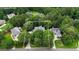 An aerial view shows the property's boundaries and its location among mature trees in a residential neighborhood at 821 Carnellian Ln, Peachtree City, GA 30269