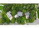 Aerial view showcases houses nestled among mature trees in a residential neighborhood at 821 Carnellian Ln, Peachtree City, GA 30269