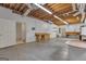 Spacious basement with exposed ceiling and workshop benches at 821 Carnellian Ln, Peachtree City, GA 30269
