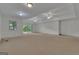 View of the carpeted basement area with sliding glass doors to the outside and recessed lighting at 821 Carnellian Ln, Peachtree City, GA 30269