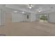 Large finished basement with neutral carpet, recessed lighting, and a sliding glass door to the outside at 821 Carnellian Ln, Peachtree City, GA 30269