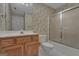 Charming bathroom with floral wallpaper, wood vanity, and shower at 821 Carnellian Ln, Peachtree City, GA 30269