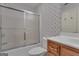 Well-maintained bathroom with a shower, toilet, and vanity at 821 Carnellian Ln, Peachtree City, GA 30269