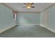 Bedroom with light-blue walls, carpet flooring, and a ceiling fan at 821 Carnellian Ln, Peachtree City, GA 30269