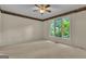 Carpeted empty bedroom filled with natural light at 821 Carnellian Ln, Peachtree City, GA 30269