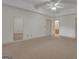Neutral-carpeted room with ample lighting and a view of the bathroom is ideal for relaxing or working at 821 Carnellian Ln, Peachtree City, GA 30269