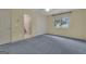 Bright bedroom with a window and ensuite bathroom entrance at 821 Carnellian Ln, Peachtree City, GA 30269