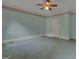 Bedroom with light-blue walls, carpet flooring, ceiling fan and a closed door at 821 Carnellian Ln, Peachtree City, GA 30269