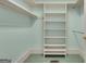 Walk-in closet with open shelving and bar for hanging clothes at 821 Carnellian Ln, Peachtree City, GA 30269